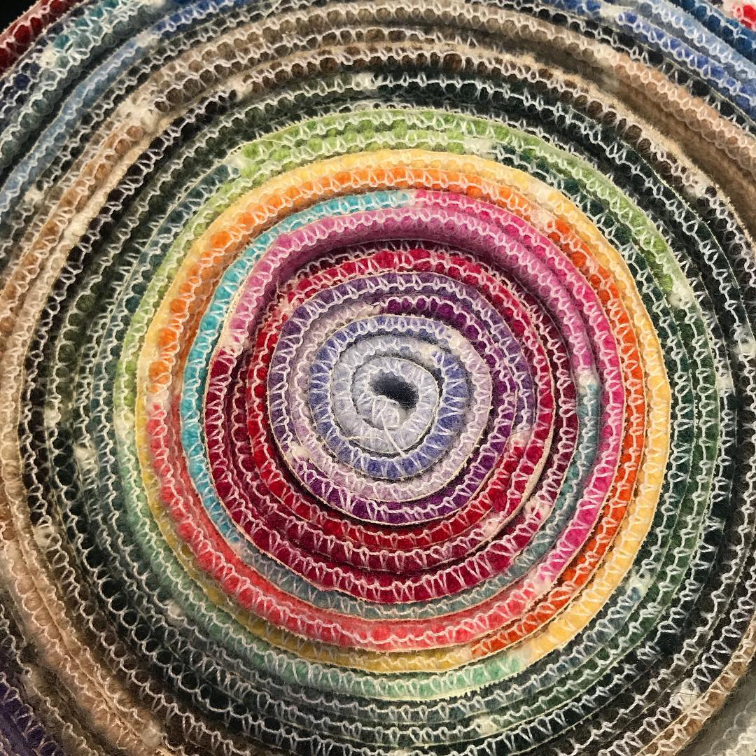 A roll of cashmere fabric in every different colour.